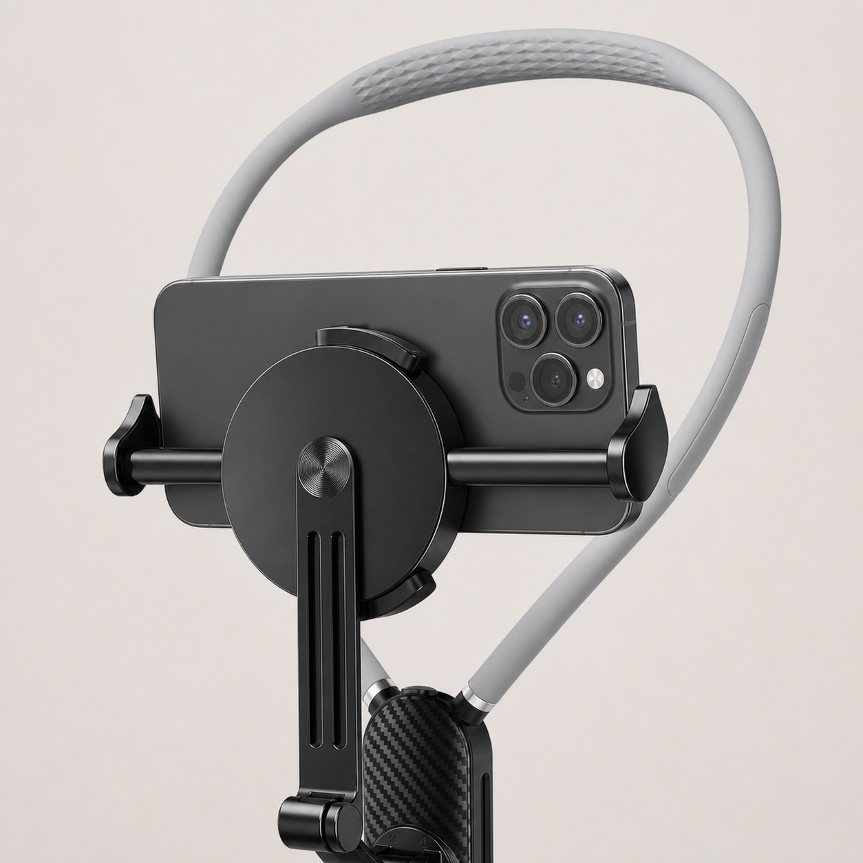 Close-up of the Norevyn POVLoop clamp securely gripping a smartphone between both padded jaws